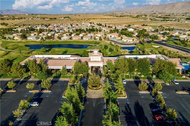 aerial view featuring a residential view and a water and mountain view