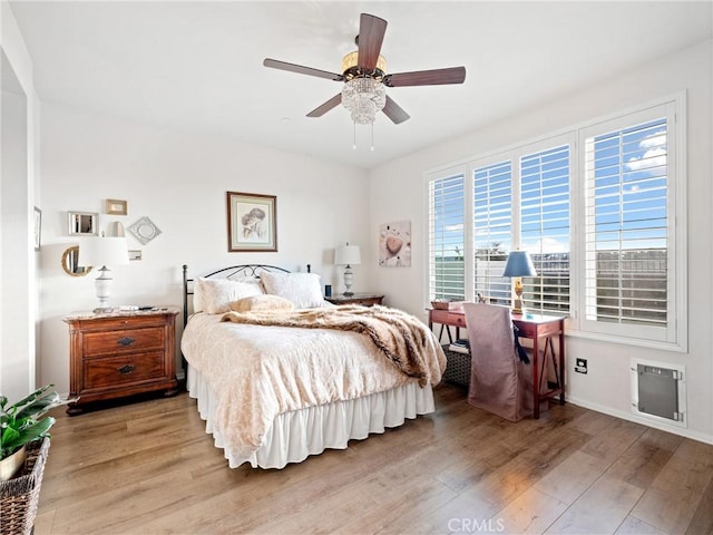 bedroom featuring light wood-style floors and ceiling fan