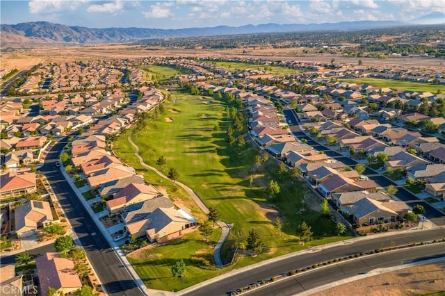 birds eye view of property with golf course view, a residential view, and a mountain view