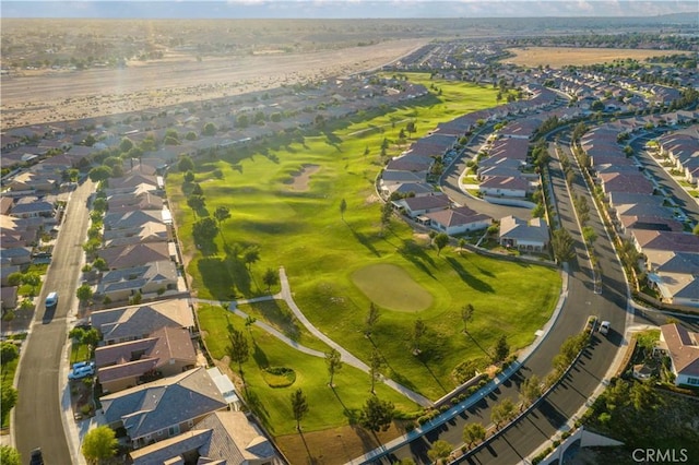 bird's eye view with view of golf course and a residential view