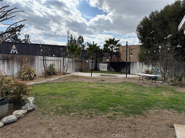 view of yard with a fenced backyard