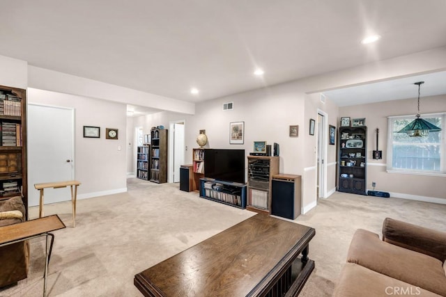 living area with light carpet, baseboards, visible vents, and recessed lighting