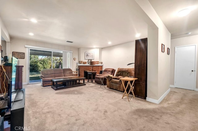 living room featuring recessed lighting, a fireplace, carpet flooring, visible vents, and baseboards