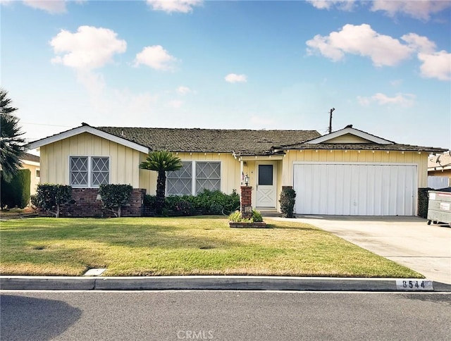 ranch-style house with a garage, a front lawn, concrete driveway, and brick siding