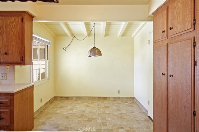 interior space featuring beamed ceiling