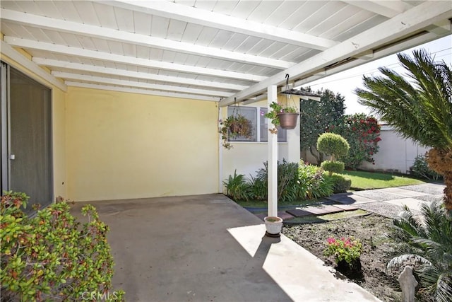 view of patio / terrace featuring a carport