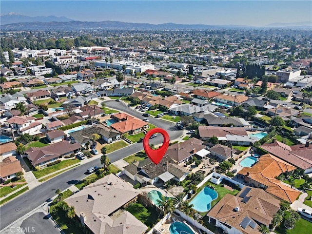 bird's eye view featuring a residential view and a mountain view