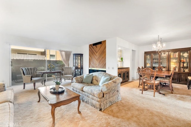 living area featuring light carpet and a notable chandelier