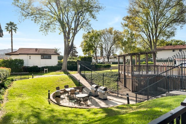 view of yard featuring fence and a patio