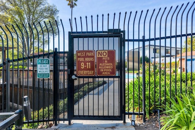 view of gate with fence