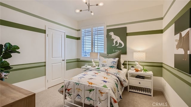 bedroom featuring light colored carpet and a notable chandelier