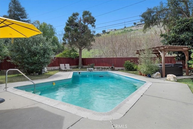 view of pool with a pergola, a patio area, a fenced backyard, and a hot tub