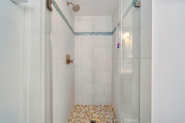 bathroom with a shower stall