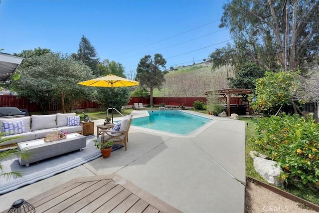 view of pool with a patio area, a fenced backyard, and an outdoor living space