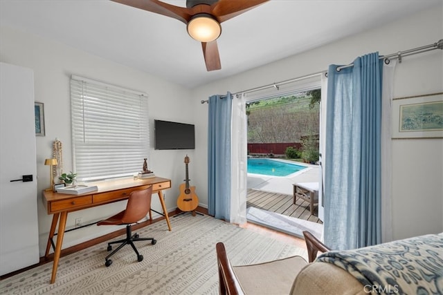 bedroom with access to exterior, baseboards, and a ceiling fan