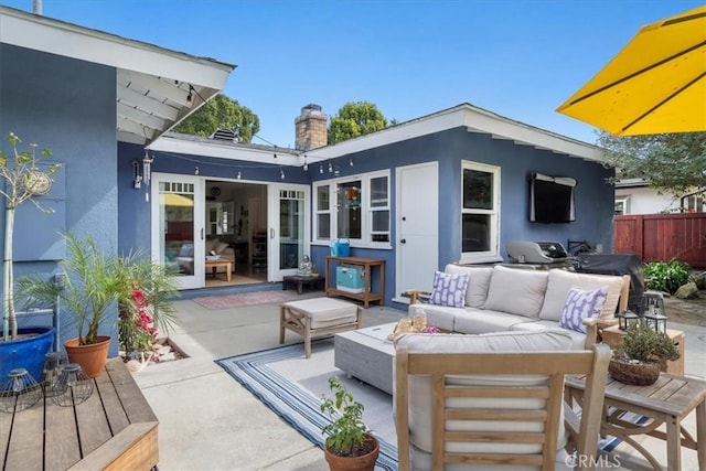 exterior space with fence and an outdoor living space