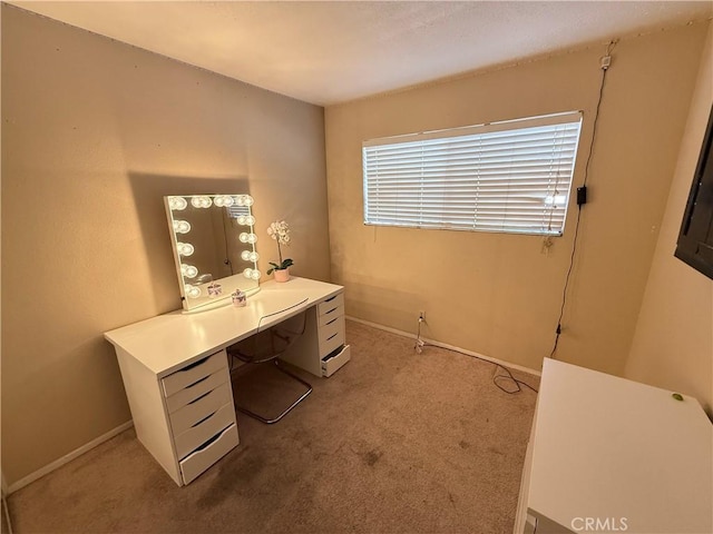 home office featuring carpet flooring and baseboards