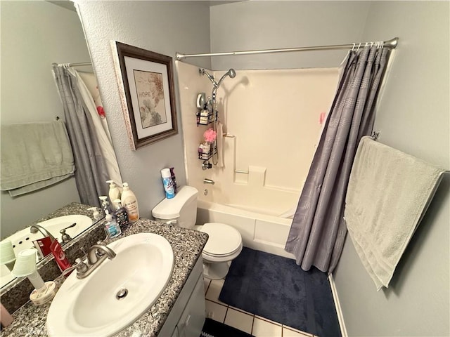 full bathroom featuring tile patterned flooring, shower / bath combo, vanity, and toilet