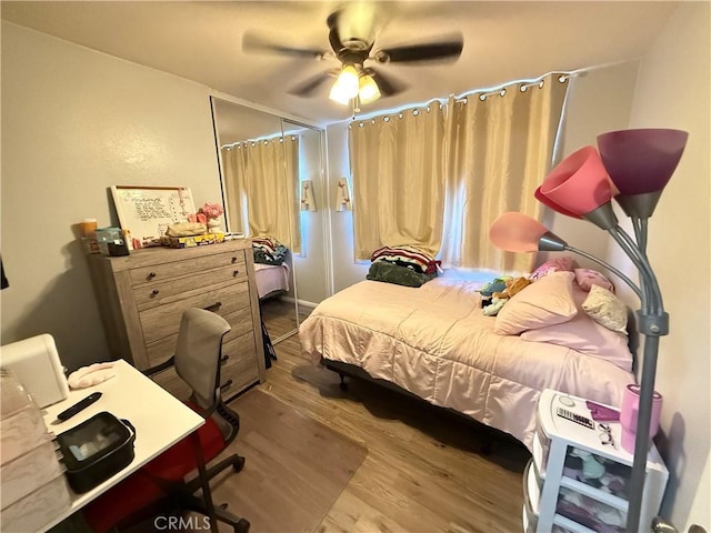 bedroom featuring ceiling fan and light wood-style floors