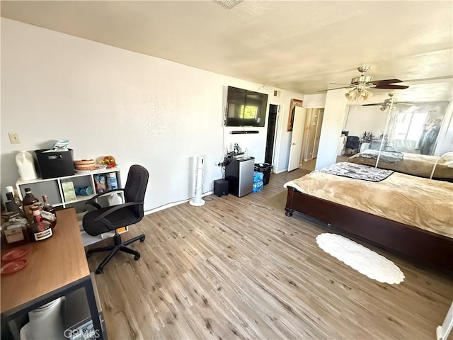 bedroom featuring wood finished floors