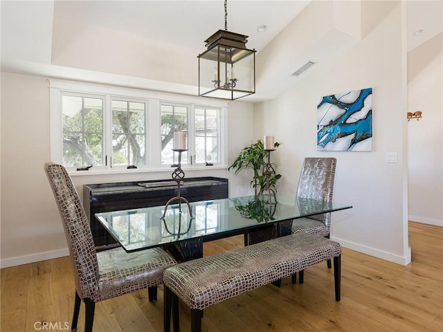 dining area with light wood finished floors, visible vents, baseboards, and recessed lighting