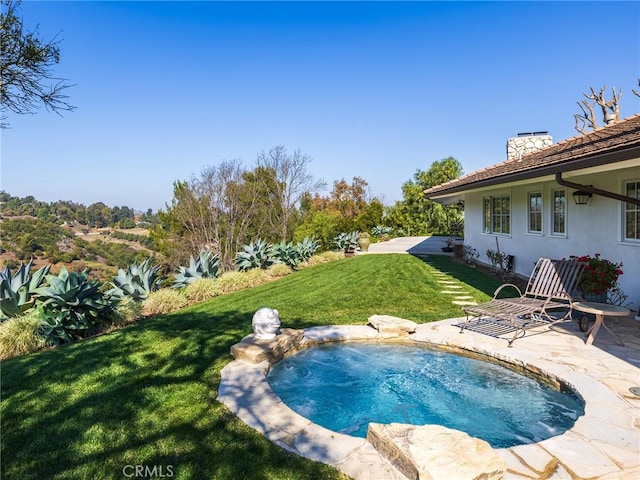 view of pool with an in ground hot tub, a yard, and a patio