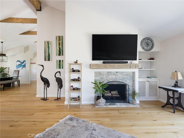 living room featuring beam ceiling, a stone fireplace, high vaulted ceiling, light wood-type flooring, and baseboards