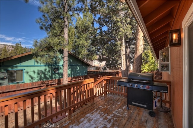 deck with fence and grilling area