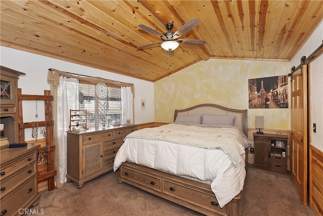 carpeted bedroom with lofted ceiling, wood ceiling, and a barn door