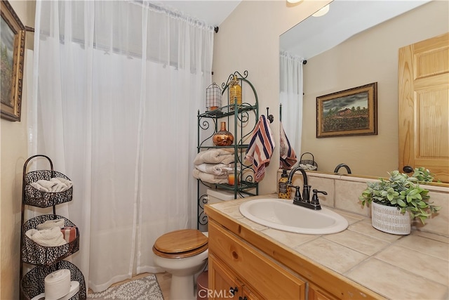 full bathroom featuring toilet and vanity