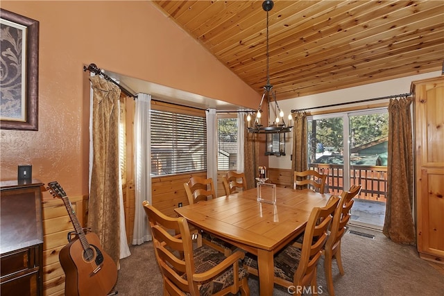 dining area featuring lofted ceiling, wooden ceiling, plenty of natural light, and dark carpet