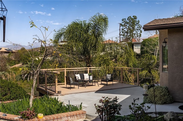 exterior space featuring a deck and an outdoor living space