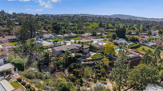 birds eye view of property with a residential view and a mountain view