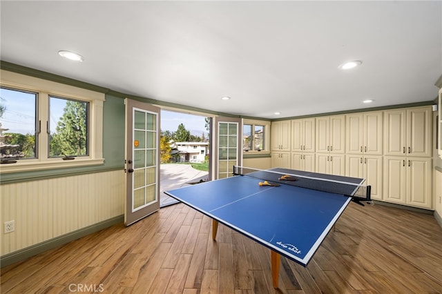 playroom with recessed lighting, french doors, and wood finished floors