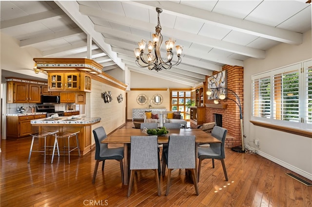 dining area featuring dark wood finished floors, a fireplace, vaulted ceiling with beams, visible vents, and an inviting chandelier