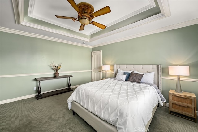 bedroom with carpet floors, a raised ceiling, and crown molding