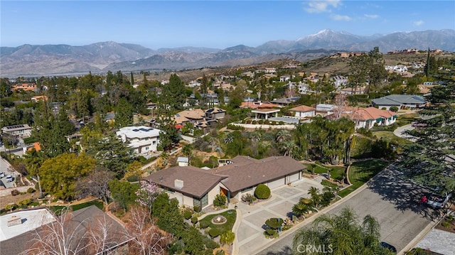 drone / aerial view featuring a residential view and a mountain view