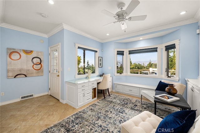 office space with visible vents, crown molding, built in desk, and baseboards