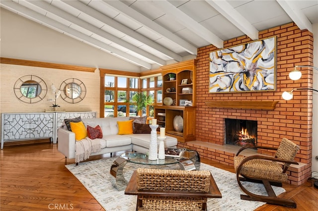 living area with a fireplace, vaulted ceiling with beams, and wood finished floors