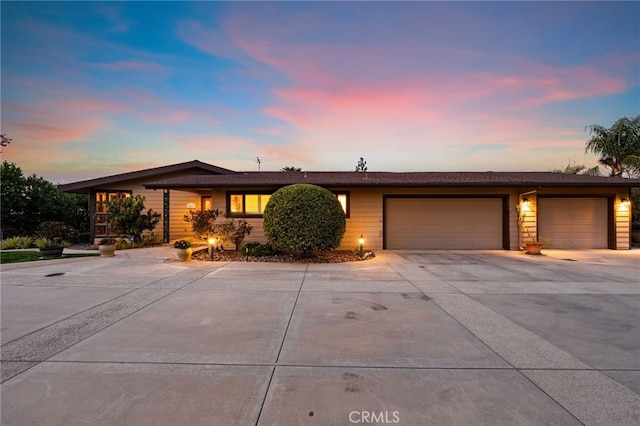 view of front of property with a garage and driveway