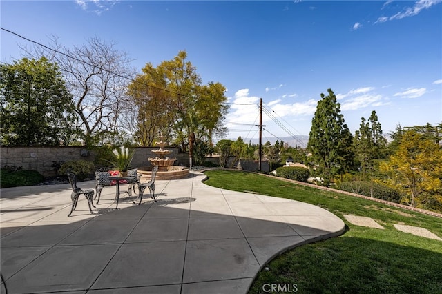 view of patio featuring fence