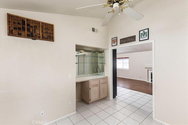 40292 Corte Delfin, Murrieta, CA 92562 - kitchen featuring visible vents, a ceiling fan, light countertops, light tile patterned floors, and built in study area