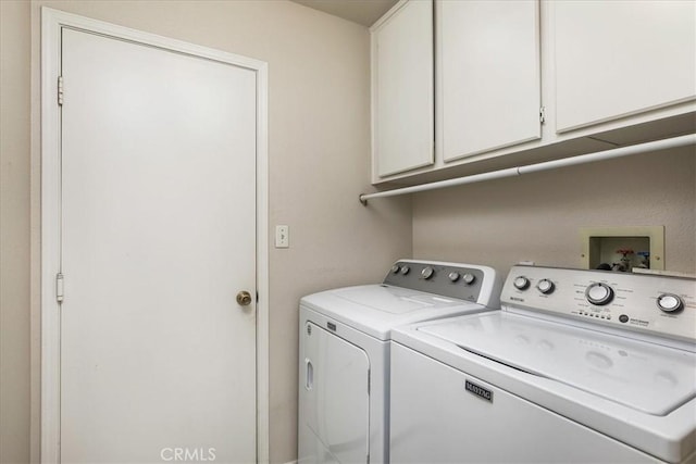 40292 Corte Delfin, Murrieta, CA 92562 - laundry room with cabinet space and washer and clothes dryer