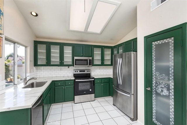 40292 Corte Delfin, Murrieta, CA 92562 - kitchen with green cabinets, appliances with stainless steel finishes, and a sink