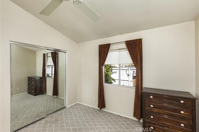 40292 Corte Delfin, Murrieta, CA 92562 - unfurnished bedroom with baseboards, ceiling fan, vaulted ceiling, a closet, and light colored carpet