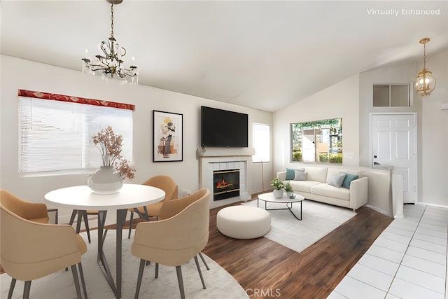 40292 Corte Delfin, Murrieta, CA 92562 - living area with a chandelier, lofted ceiling, a tile fireplace, and wood finished floors