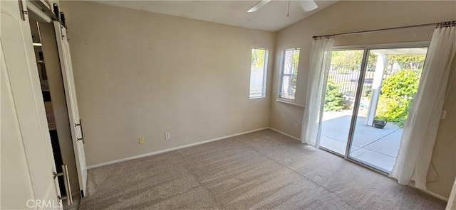 40292 Corte Delfin, Murrieta, CA 92562 - spare room with a ceiling fan, carpet flooring, a barn door, and lofted ceiling