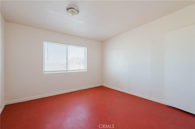 empty room with baseboards