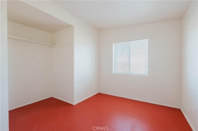 empty room featuring baseboards