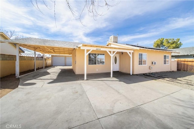 rear view of property with fence